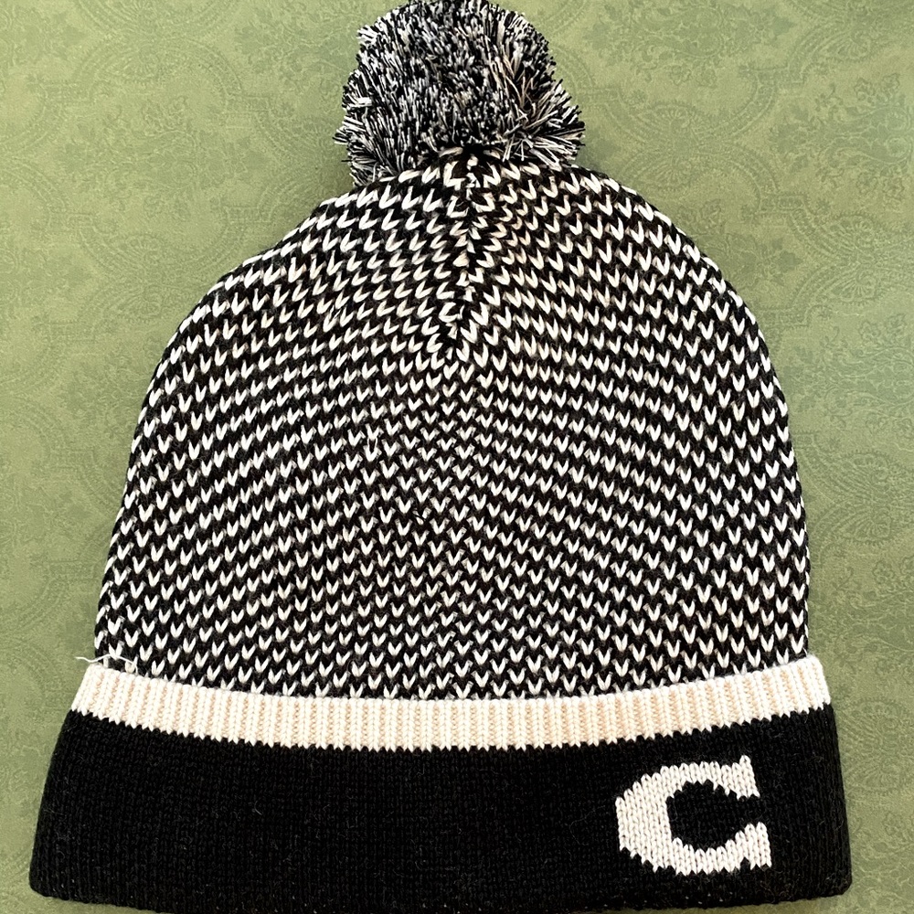 Coach Black and White Women’s Pom Pom Winter Hat.